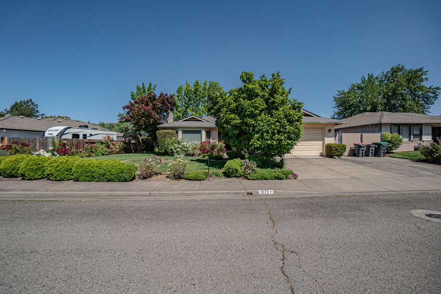 This East Medford home has over 1797 sq.ft. of living space with 3 large bedrooms and 2 full bathrooms. As  you enter this home you will notice the large living room that offers a lot of natural light as well as an eating area located off the kitchen. The kitchen has plenty of cabinet and counter space. The primary bedroom, located at the back of the home, has double vanity and walk-in closet. The other two bedrooms are large too. Inside washer/dryer. New toilets as well as a brand new efficient water heater. The backyard has mature landscaping and there is even gated RV parking.