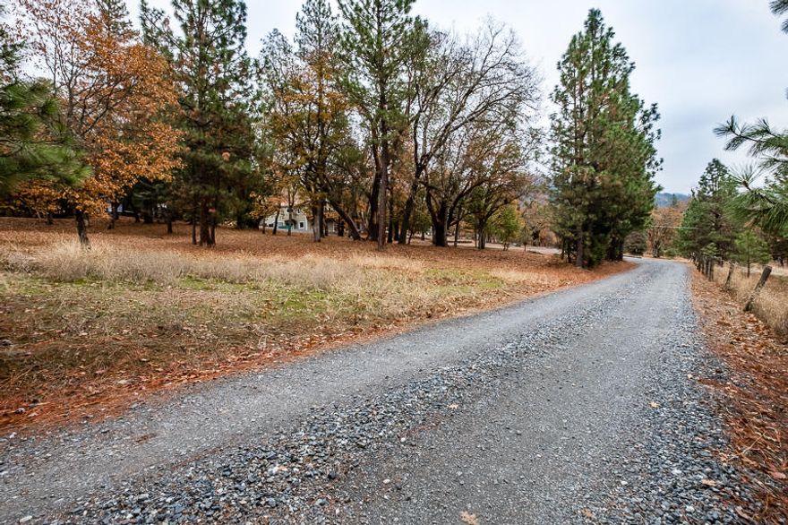 Come tour this hidden gem of a 3-acre property! This home has been extensively renovated. Boasting a spacious multi-level floor plan, the grounds are wonderful for entertaining. The upstairs master has a peaceful patio for your morning coffee and the ability to add its own entrance to convert it to a separate unit. Enjoy plenty of time outside with over 1,000 sq ft of spacious decking. There is an almost 2,000 sq ft basement that can be used for a large variety of uses. In the past, the grounds have hosted multiple large entertainment events. Only minutes from some of the top wineries in southern Oregon and the wonderful historic town of Jacksonville, do not let this one get away from you!