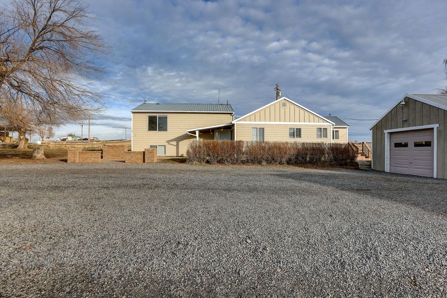 Enjoy privacy and the farm life on this country property. Spanning over a generous 140 acres, including 131 acres of Deschutes River water rights, this exceptional property reveals itself as a productive irrigated farm; nestled it the heart of Central Oregon. Enjoy the magnificent views of the Cascade Mountains that changes with the seasons. The view is perfectly complemented by a thoughtfully designed split-level residence. The master suite is located upstairs. The kitchen is highlighted by granite countertops. For enthusiasts of equine life, this property reveals itself as a gated haven for all things horse-related, a 24×104 barn is fully equipped with dedicated stalls, hay storage, and a tack room to comfortably accommodate your horses. Completing the outdoor amenities is a highly serviceable shop space and a detached garage. The garage is equipped with a workbench to support handy maintenance tasks. The shop will allow indoor RV parking space. Schedule a showing today.