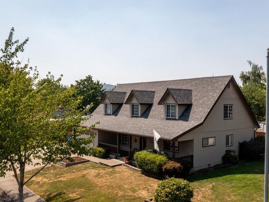 Beautiful, Spacious Custom-Built Home, in Excellent Eagle Point Neighborhood. Perfect 2-family set-up! Main level has large master suite, separate living room & family room, additional bedroom, dining area, kitchen, plus additional 1/2 bathroom. Upstairs there are 3 bedrooms plus full bathroom. This home has great curb appeal with large covered front porch, perfect for relaxing in the evening. The sellers have taken immaculate care of the entire home and the property. All white vinyl windows, upgraded laminate flooring, huge paved RV parking with hook-ups, hot tub ready, and more. Custom kitchen cabinets, breakfast bar, recessed lighting, and all appliances stay. Enjoy the fully fenced back yard with covered patio, separate deck area perfect for BBQ's or summer night entertaining, & detached shed. Close to schools, shopping a neighborhood parks. Must tour.