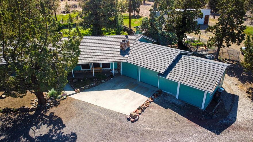 Well taken care of single-story home among a wonderful setting with stunning Cascade Mountain views. Bring your animals – property has a fenced-in pasture and two acres of COI irrigation. Home has a tile roof and an open floorplan with solarium allowing for tons of light, large closets with built-in organizers, pantry storage cabinets and tile and laminate flooring. Additional interior features include tile kitchen counters, updated windows, a newer ductless heat pump and a beautiful rock fireplace. Property is fenced and cross fenced with an additional dry lot. Exterior features include a back paver patio, a garden spot and an oversized 3-car garage. There's also a detached 3-bay machine shed/barn combo with two stalls and space for additional stalls.