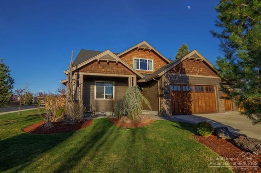 Beautiful Craftsman home in immaculate condition inside and out. Vaulted ceilings, stainless steel appliances, MASTER ON MAIN, lots of storage in finished attic space. Small garden barn w/attached dog kennel. Boat or RV parking, large 3 car garage. Mature landscaping and spacious 10,000 SF lot. Outdoor fireplace w/covered area to barbeque and entertain. Very quiet neighborhood. Enjoy easy access to Redmond's dry canyon across the street for miles of walking, jogging or bike riding. Must see!!