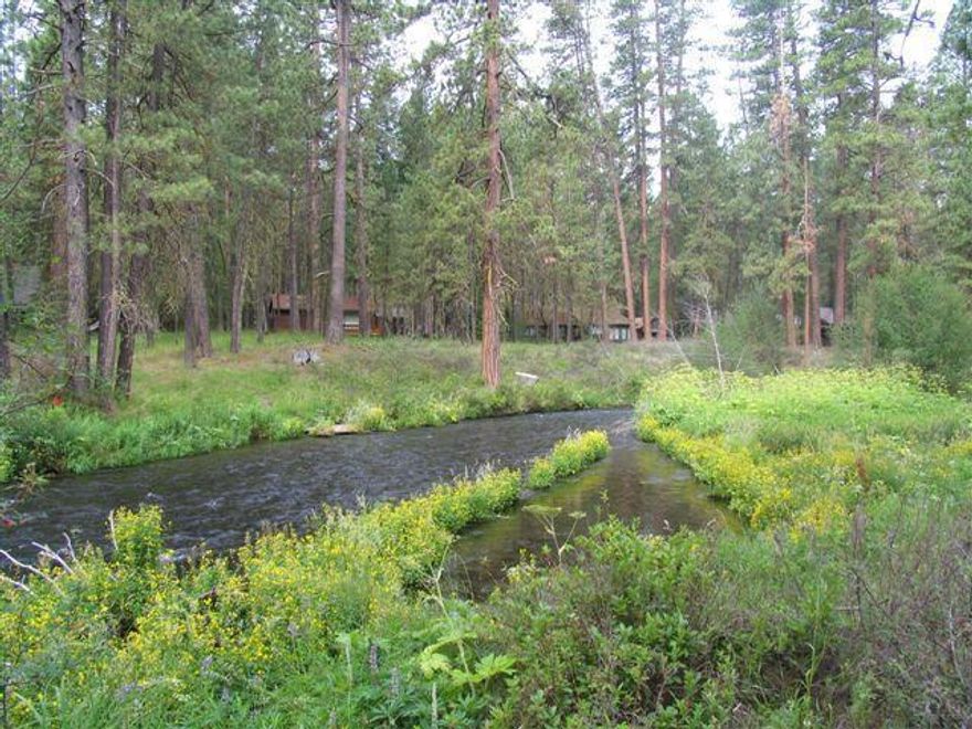 Beautiful setting in old growth ponderosa pine forest fronting the Wild & Scenic Metolius River. Well cared for 2BD/1BA, 928+/- sq. ft. cabin w/knotty pine cabinets and paneling, laminate flooring, wood stove, bath w/laundry and nice decks front and rear. Detached outbuilding w/shop area for your tools and toys. Filtered Metolius River water serves the cabin. Fully furnished and ready for your vacation getaway. US Forest Special Use Permit. Enjoy year round recreational opportunities out your cabin door.