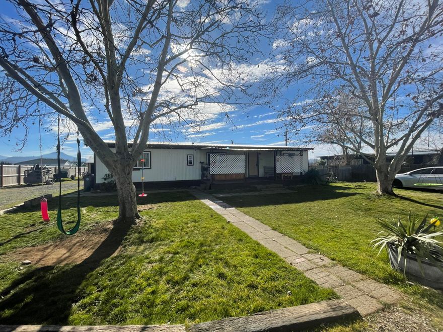 Fantastic investment opportunity! Hard to find 1 acre on city services, with a well, as well as city water, zoned WCUR-6. Right next to Woodland subdivision, utilities
already there with a 3 bedroom, 2 bath, 1344 square foot home. Nice floor plan, with a covered patio out back. The land goes beyond the fence out back with fantastic views of Mt Mcglaughlin. Great location, with easy access to Foothill, or Hwy 62. Within an hour of several lakes, the Rogue River, Waterfalls, and hiking trails. 24 hour notice
required for all showings, appointment only!