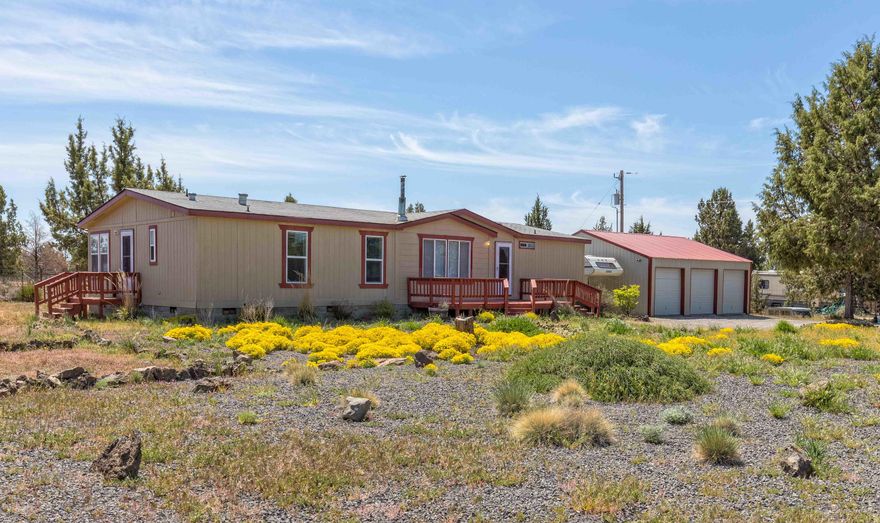 Enjoy your piece of heaven in Central Oregon! You can see Mt. Jefferson and wildlife abound from this ready to live in, well maintained manufactured home on 1.58 acres with 3 bedrooms, 2 baths and den. There is a certified wood stove to stay cozy on winter nights. Front or back deck to take in the tranquility, courtyard for gatherings, and separate fenced garden area with greenhouse to grow your own veggies. Plenty of parking with detached 3 car garage, work benches, overhead storage, and office. Lots of extras, washer / dryer, new range oven, microwave, uv light air filtration, freezer, refrigerator.