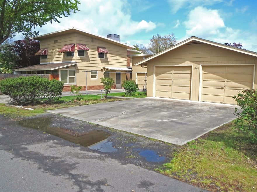 This home is truly unique and offers numerous potential options. This large 2,600 square foot, 4 bedroom/3 bath mid-century custom home is located close to downtown and is absolutely one-of-a-kind. There are too many unique features in this home to list here. The owner grew up in the house. There is a single-car detached garage, there is an additional detached plumbed 2-car garage/shop with a half bath and work room that was previously used as a shop by the original builder/owner. Situated on a 0.24 acre lot, which occupies the corner of 8th, Hamilton & 9th Streets. The mature landscaping adds to the charm of this property. It is priced to sell quickly. Don't miss out on this opportunity.