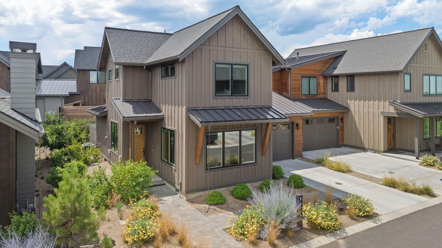 Highlands Ridge was created for discerning buyers seeking affordable luxury in the heart of Bend's premier resort community, Tetherow. This rare Manzanita model offers 1,652 sq ft over two levels with a wide-open floor plan that lives like a detached home, only attached at the garage. The main level features a spacious great room and chef's kitchen with a large island and 6-burner range. Upstairs, two full suites offer comfort and privacy for owners and guests. The west-facing patio is ideal for relaxing, with hookups for a hot tub or fire pit and space for dining or lounging. Located just steps from the new homeowner pool and all of Tetherow's world-class amenities, including trails, dining, fitness, golf, and more. Enjoy luxury, convenience, and recreation in one of Bend's most sought-after communities.