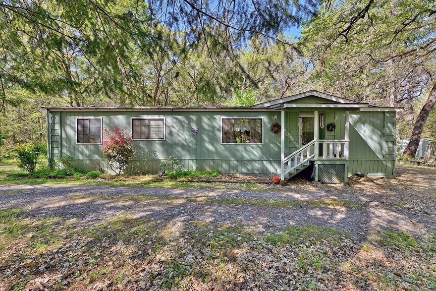 Back on market, no fault on property.  Tucked away just off Robertson Bridge Road, this well-loved and maintained double-wide manufactured home offers peaceful living on 3.59 beautifully wooded acres. Featuring 3 bedrooms, 2 bathrooms, and 1,568 sq ft of space, the home includes both a family room and a living room, a dining area, and a convenient breakfast bar — perfect for comfortable everyday living. Privacy abounds on this serene property, complete with a two-car garage/shop ideal for tinkering, storage, or hobbies, plus an additional shed. Two wells are on site, one of which is capped. A true private retreat with all the space you need!