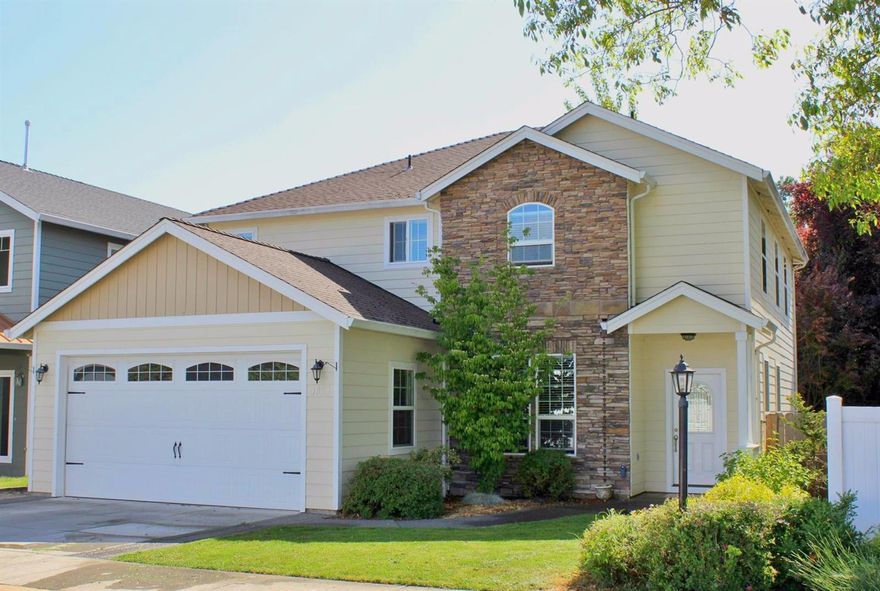 This fantastic custom home features new carpet throughout the 3 bedrooms, with 2.5 bathrooms, an office, & finished two-car garage. You'll love the elegant vaulted entry and dual-sided fireplace which can be enjoyed from both the living and dining rooms. Well-equipped kitchen w/ granite counters, stainless appliances & breakfast bar which opens to the dining room. Private rear-facing master suite boasts dual vanities, corner soaking tub, tile shower and a huge closet. Upstairs you will find 2 spacious bedrooms and a full bathroom + laundry room. Private covered back patio is perfect for relaxing with family/friends. Small fully-fenced back yard is easy to maintain. There is even a little neighborhood park for the kids to enjoy!