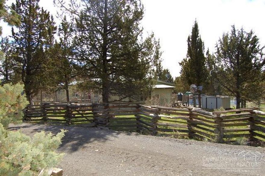 Relax & enjoy the shade & privacy offered by the quaking aspen on this secluded 5ac horse property w/high producing private well. Nicely updated mfd home w/effective year of 2000. 3Bed 2ba w/multiple living room/family room spaces, formal D/R or use as office/den, lg utility w/pantry area, mud sink & access to lg covered back deck from slider in dining rm to enjoy the almost new Jacuzzi hot tub. Shop w/enclosed tool rm & open wood shop area. 2 Round pen areas, cleared flat for barn or lg shop.Property fenced & X fenced, lg fenced garden area, seasonal pond, 2 carports & multiple storage sheds.Gated entry w/split rail fence to circular drive. RV parking & hookup.