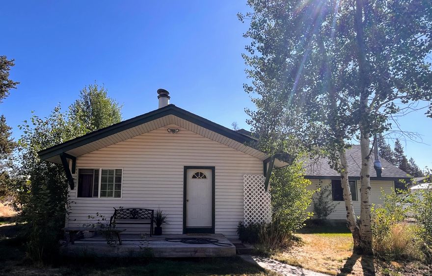 This property boasts 1.18 acres within the city of La Pine, featuring three bedrooms, 1.5 bathrooms, and a 1652 sq ft frame home. It offers a spacious living area perfect for entertaining, a bonus room with a fireplace that can serve as a fourth bedroom, large office, or cozy family room. Additionally, the property includes a 36x36 shop with an RV door and an insulated heated office. The backyard is landscaped and equipped with three sprinkler stations. It is also fenced, with two gated entries and a circular drive. The home is set back from the road, ensuring privacy. Furthermore, it is connected to city water and sewer, while still having a productive well for outdoor watering and projects.