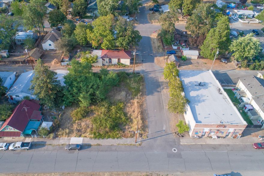 Lots of potential with this commercially zoned lot in downtown Gold Hill. Plans had been approved (but are expired now) for a condo triplexwith parking lot. This is the same plan that was used for the condos in Jacksonville behind Ray's Market. Since plans were approved previously, it should notbe a problem to get them approved again or bring your own plans and imagination. (Buyer to do their own due diligence) Great location near downtown GoldHill.