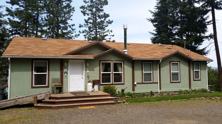 Quiet peaceful rural location with Mountain and Valley views. Fenced backyard with large deck, small shop and shed on just under five and half acres. Interior is an open floor plan with lots of storage in the kitchen, vaulted ceilings and master bath with double sinks and large soaking tub. Well maintained and ready for new owners.