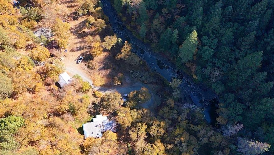 Almost 8 acres of property with Jumpoff Joe creek flowing right thru! This unique property has two houses on it with one as an additional Dwelling. Main house is 2 bedroom and one bath and guest qtrs house is 1 bed and one bath.  Enjoy views of your own year round creek with mountain views, level land for gardening and parking for whatever.  Remodeled ADU has beautiful remodeled amenities and the upstairs is a full master with LED lighting and sound system with a deck.  Can be a great two family setup or hardship property. Ready to enjoy Oregon beauty? See this property with Creek, mountains and usable property today! All information deemed accurate but not guaranteed and subject to change at any time.