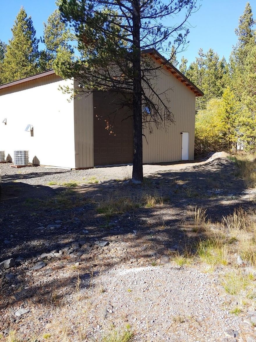 1728 square foot shop/rv structure. Power installed, insulated. Loft for extra storage. Close to Forest land, Big Deschutes river, Sunriver, Mt. Bachelor, and the high lakes.