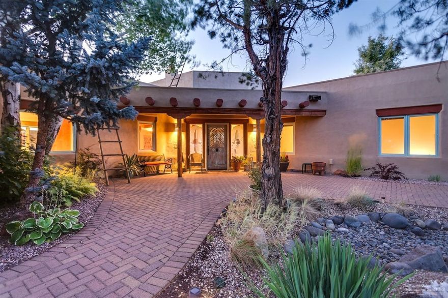 Santa Fe meets the high desert. One level living with views of the river, Cascade range and BLM lands across the ravine. Makes for amazing sunsets. Private master suite w/patio including good separation from the additional 2 bedrooms. Great room with high ceilings with wood accents. Dining room and built-in seating for dining off the kitchen. Tiled counters in the kitchen. Additional patio off the sunroom. Separate shop for the car enthusiast/ artist studio. Must come see to appreciate this home.