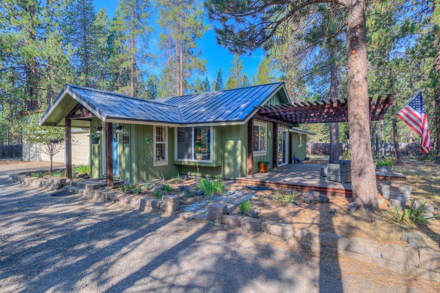 Looking for a stick built home in La Pine on a 1 acre lot fenced with mature ponderosa pine trees. This home is located in Newberry Estates just minutes to Mt Bachelor, Paulina lake, East lake and all the High Cascade Lakes. This 2 bedroom 2 bathroom home has over 1180 sq. ft of living space, Open Great room with wood vaulted ceilings, wood style floors, barnwood doors, solid surface kitchen countertops, stainless steel appliances, newer windows throughout. Custom bathrooms with tile shower and tile floors. Large deck off the dining area and Great room. This property has a 3 car shop with 3 garage doors and one with an opener. There is a work bench area. The town of La Pine is just minutes away for all of your needs. Come see what this home has to offer.