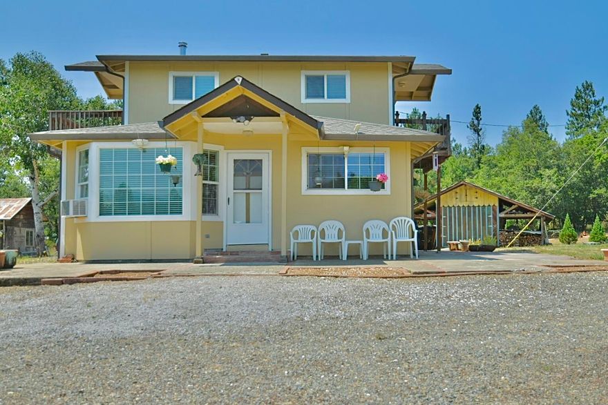 Southwest Oregon mini ranchette with well built two story, 3 bedroom, 2 bath, ranch house with attached double car garage. Separate 1344 sq ft garage/shop, 240 sq ft shed, 288 sq ft shed and room galore for farm equipment or trailers. Beautiful views from this house and property off the Marble Mountain Wilderness area. Level pasture, fruit trees, garden area galore and more. Great animal property for horses, sheep, llamas or ? Only 4.4 miles to Cave Junction and in a nice rural residential neighborhood. This is a fantastic property to raise your family and grow your food. Back up generator included.