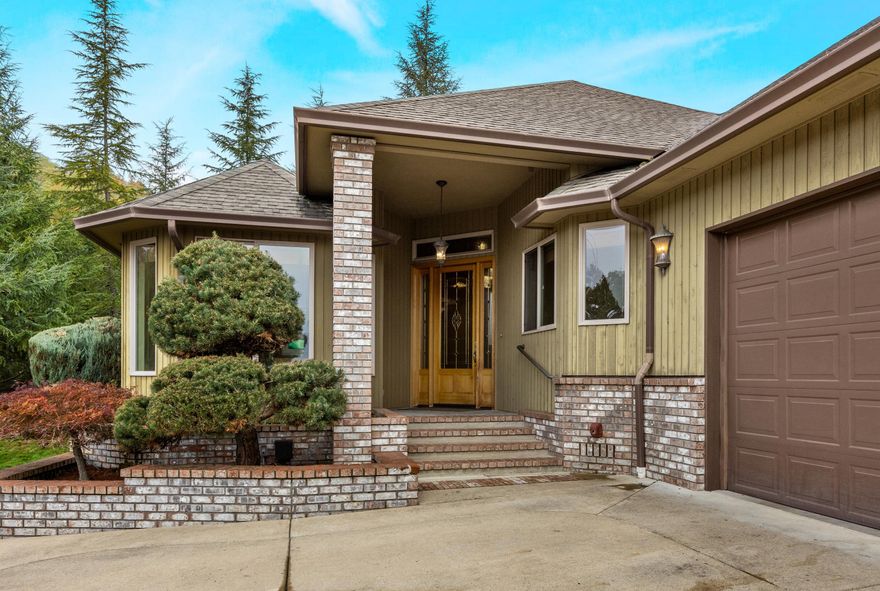 Welcome to this stunning one-level custom-built home in a highly desirable Rocky Ridge neighborhood. Step inside to a grand 12ft foyer that opens to a spacious, light-filled floor plan with soaring 9ft ceilings throughout. Gourmet kitchen is a chef's dream, featuring large slab granite island, premium Wolf gas stove with custom hood, double ovens, stainless steel appliances, pantry and eating area. Inviting living room and dining area boast gas fireplace and luxury laminate flooring. Primary suite features generous ensuite with double sinks, jetted tub, large shower and walk-in closet, as well as access to private covered patio. Completing this exquisite home are well-appointed laundry room, office nook and spacious two-car garage with ample storage. Outside you'll find a beautifully landscaped yard - perfect for entertaining or relaxing. Don't miss the chance to make this exceptional property yours!