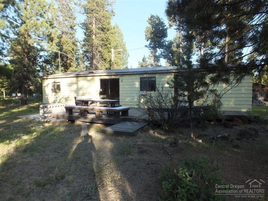 This Homepath property consists of a mfd home in good condition, on a huge, 1.6 acre lot. It is located in an area of nice homes. It is on a corner lot, with driveways on both roads. There is a very well built, 900 square foot garage on the property. The neighborhood is peaceful and quiet, and located close to a lot of great lakes and rivers. Take a look at the wet bar in the living room and the cool built in stereo! This is a Fannie Mae Homepath property.