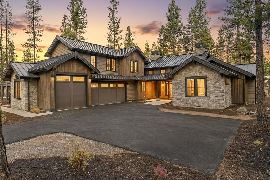Experience refined living in this new 5-bedroom home by Curtis Homes LLC, located in the heart Caldera Springs-the Pacific Northwest's premier residential resort community. Thoughtfully designed with elegance and functionality in mind, this mountain-contemporary styled home offers luxury comfort across a generous half-acre homesite with serene stream views. Inside, a soaring double-height great room seamlessly flows into a vaulted dining area and chef's kitchen with large walk-in pantry, spacious island and separate breakfast nook.   Expansive glass doors open to covered outdoor living, creating a seamless indoor-outdoor connection. The main level offers a well-appointed primary suite complete with a fireplace and luxurious en-suite bath, along with a secondary en-suite and a third bedroom. Upstairs features two additional bedrooms, a spacious bonus room and a full bathroom. Live the Caldera Springs lifestyle with access to year-round resort amenities-20 minutes to downtown Bend.