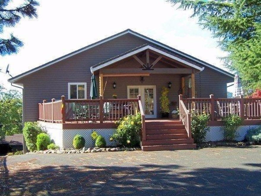 PRICED TO SELL! Custom built four bedrooms, 3 1/2 baths, 2700+ sq ft with quality, quality, quality! A kitchen to die for with granite counters, huge island, 5-burner cook-top, double convection oven, prep sinks and pantry. Bright, vaulted great room with skylights, plant shelves, hand-scrapped hardwood floors, gas fireplace and balcony view of sunsets and city lights. Main level master with double French door access to private balcony, generous master bath with granite counter vanity, jetted tub & dual head step-in shower and king size walk-in closet. More granite in the main level laundry room with mud sink & tile floors. The kids can have a field day with the three bedrooms and full bath on the next level down. And the huge lower level garage has a shop area AND enough room to park an RV with full hook-ups AND storage room complete with dumbwaiter to all levels AND another full bathroom. Wonderful covered porch with trex deck. District 7 schools.