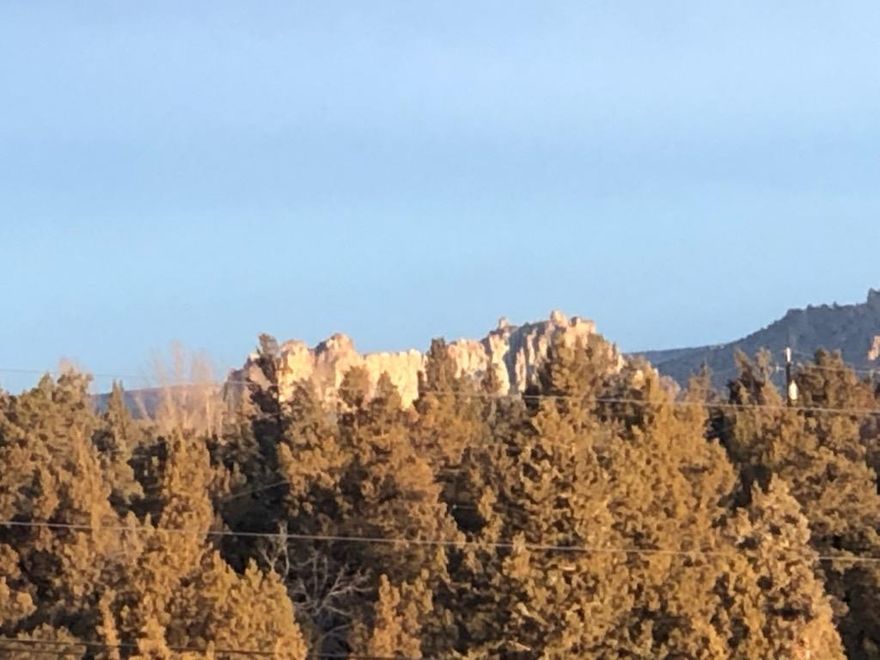 PRIVACY WITH A VIEW.. Here's fenced acreage close to Redmond,  An easy mix of sloping and level development locations with views of Smith Rock, the Ochocos and the Cascade mountains. Multiple private build sites are shielded by trees. Natural crushed cinder cone drive base with elevated building site to maximize views. Fully fenced and gated and ready for horses or...?  Septic perc test on file w/County. Majority of route (main road Upas) to site paved.  One of the few available Redmond large view lots.