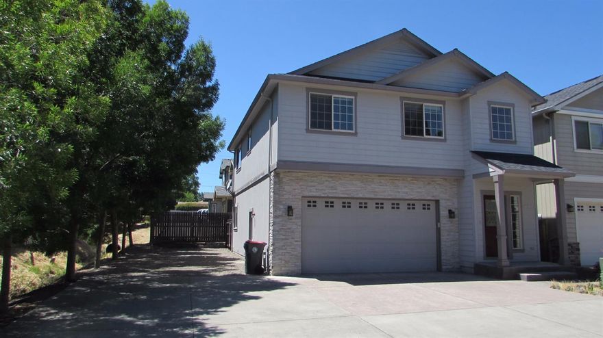 This is the beauty that you've been looking for. Offering Brand New Carpet. Beautiful Natural Slate Flooring. Stainless Steel Appliances. The laundry room offers a washer and dryer and it's located upstairs next to all of the bedrooms, like it should be. There's plenty of extra parking for vehicles or a boat or RV on the side of the house