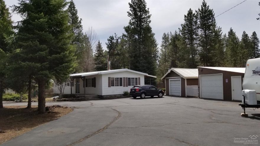 Well maintained manufactured home with 2 bedrooms, 2 bath on .99 acres, this 1008 sf home features updated appliances, nicely landscaped with water feature, covered back porch, 2 garage's with asphalt parking and driveway located on a private and quite road.