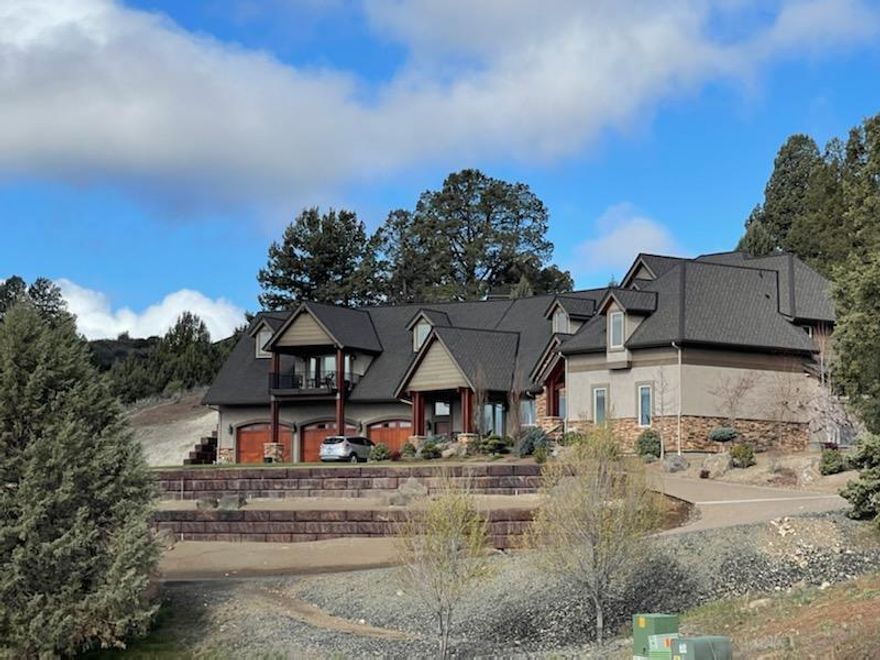 This is an immaculate, exquisite home! 5 bedrooms all with nice walk-in closets and built in shelving and drawers, 4 full baths and 2 half baths, AMAZING views, a fantastic covered patio with a built in fire pit, a theater room, PLUS a bonus room, heated floors in the kitchen and primary bathroom (along with a steamer shower) Quarts countertops, Alder cabinets, all solid Alder wood doors, all on a little over 3acres. Approx 5500 square feet and a 6 car heated garage with a dog kennel for your furry friends, a little piece of Heaven right here in Klamath Falls!