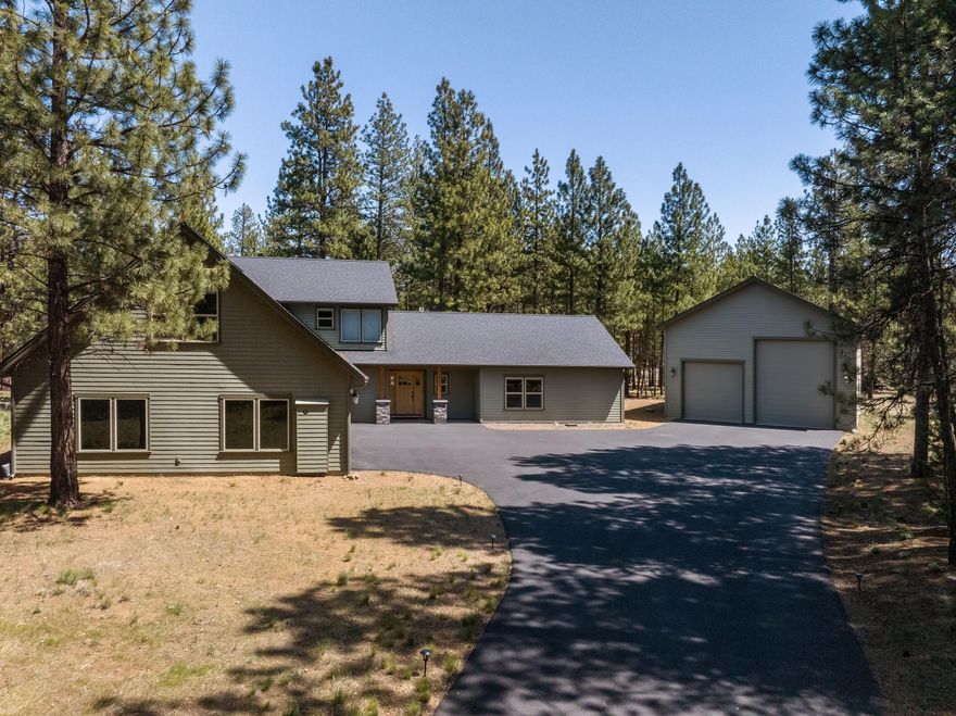 Special Property Alert! Built in 2014 by one of Sisters' top builders, this nearly new home in the desirable Tollgate subdivision sits on 0.74 acres and backs to National Forest—just minutes from downtown. The open-concept layout features a chef's kitchen with granite countertops and alder cabinets, flowing into a spacious dining area and great room with a propane fireplace and woodstove. With 4 bedrooms—including a main-level primary suite—2 full baths, and 2 powder rooms, there's room for everyone. A huge bonus room offers space for entertainment or work. Outside, enjoy an oversized 3-car garage plus a 1,200 sq. ft. RV/toy storage building with a 14' door—perfect for a fifth wheel. A rare opportunity to enjoy privacy, quality craftsmanship, and outdoor access in one of Sisters' most sought-after communities!