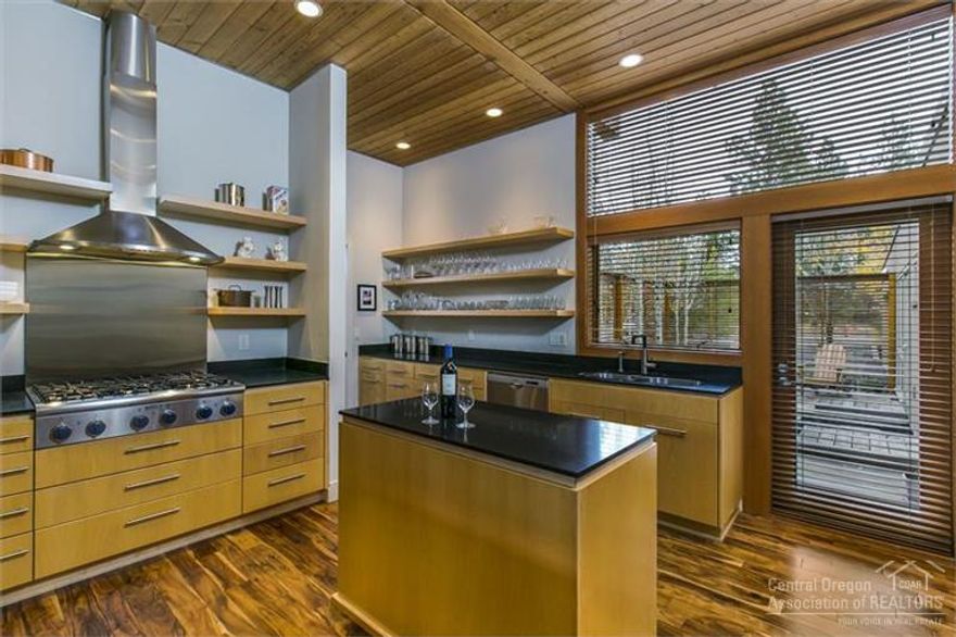 Modern architecture at its finest. One level, very low maintenance town home with many upgraded finished including honed granite counter tops, new hardwood floors, upgraded glass enclosure around master shower and more. 23x13 ft wall of windows highlighted by two German engineered sliding doors. Outdoor courtyard, outdoor wood burning fireplace with gas start, fireplace, central ac, radiant floor heat in main living and master bathroom, office area, and more. Partial Cascade Mountain views.