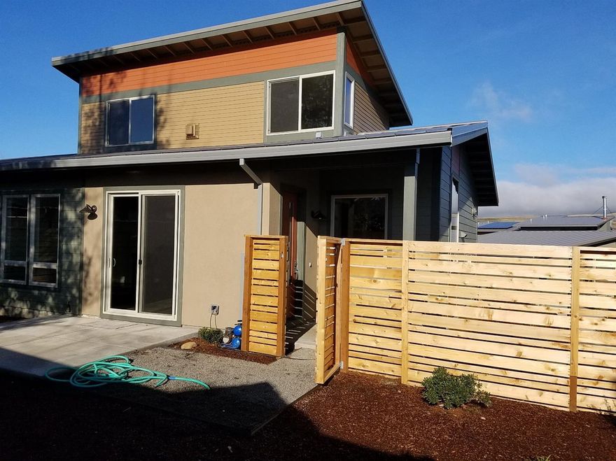 Live urban green! Come experience Ashland's first true green community, Verde Village, just minutes from downtown. It is the first subdivision in Oregon of detached single-family homes that are net-zero ready. One step above Earth Advantage Platinum, they are all designed & ready for photo voltaic arrays. Homes are placed on an east-west axis giving the home southern exposure to maximize solar gain. This allows for the reduction, or in some cases, the elimination of electric bills. This home is built with a traditional raised foundation with hardwood flooring and carpet in the bedrooms.
