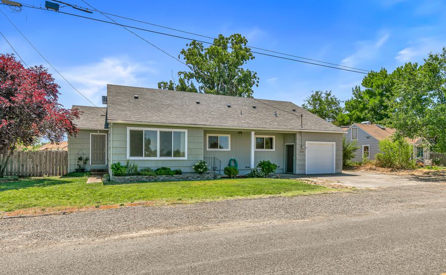 Seller is offering $10,000 credit for closing costs. Here is a very large home at a great affordable price. The bedroom set-up is flexible and works as either a 3- or 4-bedroom home. There is a living and family room along with a spacious kitchen with a gas cooktop range and laminate floors and beautifully highlighted with subway tiles. All windows have been updated with double pane vinyl and the roof is new. Home is serviced by forced air natural gas heat and central air conditioning. Outside is a large fenced backyard, raised garden beds and a 1-2 car garage...depending on size of cars. This is a great place to begin your real estate adventure in an affordable fashion as you build equity. Let's get started today!