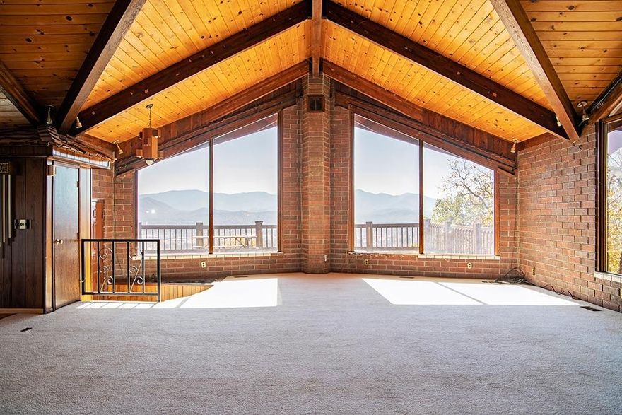 Built over 40 years ago, this completely custom home has a commanding view of Grants Pass and the valley beyond. Floor to ceiling windows drink in the far-reaching views and soaring ceilings and a wide open floor plan encourage large gatherings both inside and out. Boasting 3294 square feet, this two bedroom/two bathroom layout offers lots of options for the new owner to upgrade and update. An over-sized kitchen offers all the space you'll need to entertain friends and family. And an expansive deck where you'll relax and enjoy those gorgeous sunsets over distant mountains. Special Bonus: over 700 sq/ft shop in the daylight basement, a 720 sq/ft RV garage and 768 shop/storage building. All located on five private acres, with convenient access to District 7 schools and shopping. There aren't many like this one...don't wait!