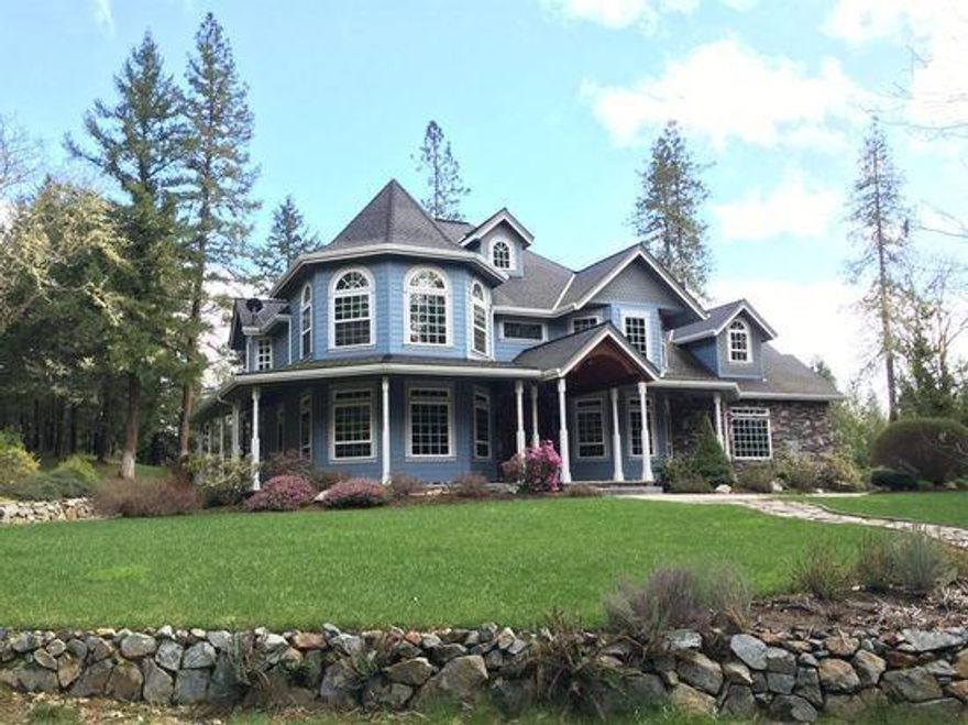 Amazing custom built home in the North Valley area of Grants Pass. Main floor features a den with fireplace, a formal dining room, very functional kitchen with propane range-oven, family room with custom vaulted tongue and groove ceiling, wood burning fireplace. Custom wood trim and wood natural wood crown molding, baseboard, door trim and stair hand rails. The 4 car shop is 60x30 with a large RV carport. The master bedroom, jetted tub.