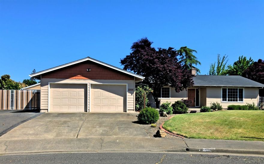 Best listing out there for under $300K in East Medford! Don't Delay! Beautifully modernized 1886sf home on a quiet cul-de-sac with a huge back yard, wide paved RV parking and a 20' X 18' shop! Wonderful over-sized living room with a wood burning fireplace and laminated wood floors that run throughout the living areas. Updated kitchen with island, pendent lights, granite countertops and floor to ceiling pantry cabinets. There is a whole-house exhaust system that cools the house off in t minutes and helps keep the cooling costs in check. This home has tons of closets, large bedrooms and even a built-in Murphy bed in the 2nd bedroom. Outside, the back deck is a massive 900sf; space enough to enjoy entertaining with the whole family. The hot tub is included. Lovely vegetable garden with raised beds. There is so much to fall in love with in this one. Don't miss out!