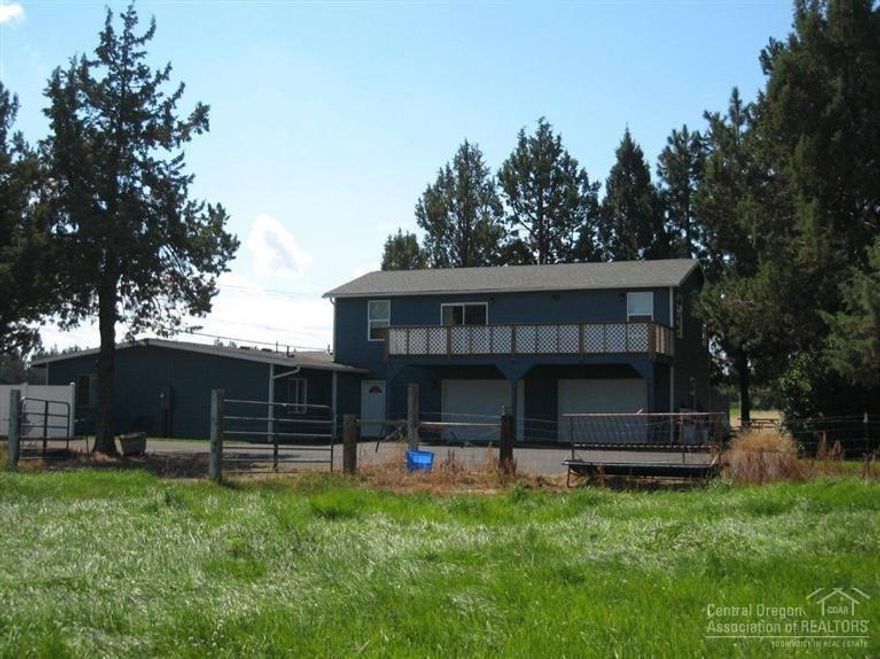 Rare 2.58 acre ranchette with 1.5 acres irrigation; fenced & cross fenced with irrigation pond & 36x36 shop with 3 bays w/ a 12 foot door & 12x36 leanto. The farmhouse has been ENTIRELY remodeled in 2007 & has many upgrades and amenities. The master bedroom is on the main floor and there are separate living and family rooms with lots of storage inside and out. Also included, newer exterior decking, large mud/laundry room, white vinyl fencing, and all located close to town and Redmond's new high school!