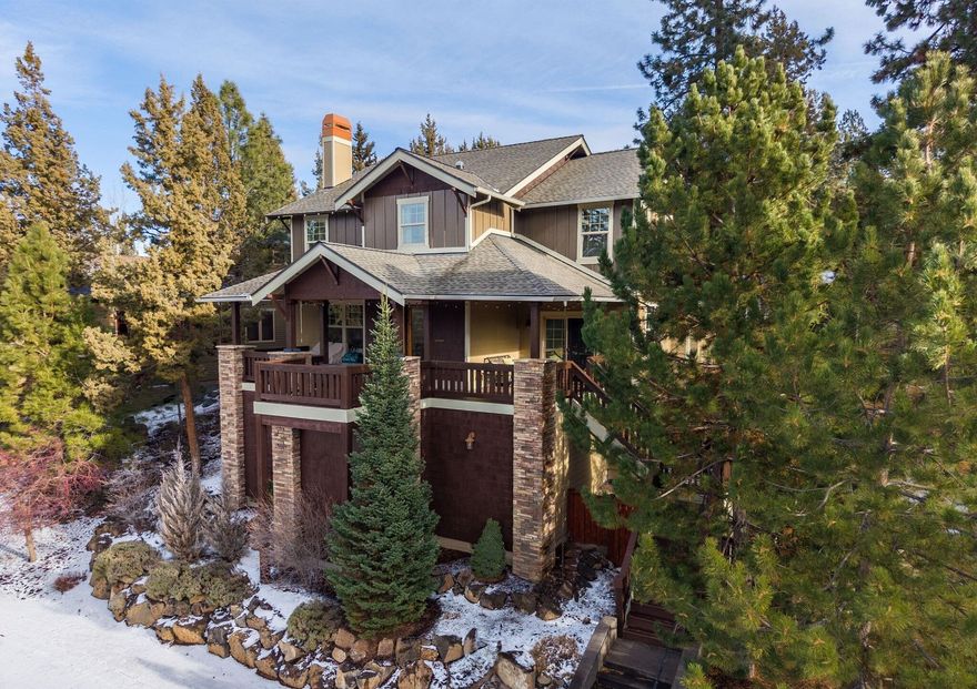 Nestled in the Enchantment community of Bend's luxurious Westside, this Northwest Craftsman style home offers main-level-living and wonderful views. Across the street from the Deschutes River with close access to the river trail, the main level has beautiful hardwood floors, primary suite with spacious bath, tiled shower, soaking tub, chef's kitchen with large island and Red Oak cabinetry, half bath, plus interior stone walls and hand-troweled walls. Built for entertaining, the covered decks create ample outdoor living space with great views of the neighborhood forest. Upstairs is a large loft for second living area, two beds, full bath, office/den. Adjacent to the property is a common area that provides nice privacy. Oversized two car garage, central vac, fenced exterior, and the large storage space under home is a must-see. New roof, exterior paint, and carpet in Fall 2024. Rare to see a home for sale in this small, peaceful community. Contact us to arrange your private showing.