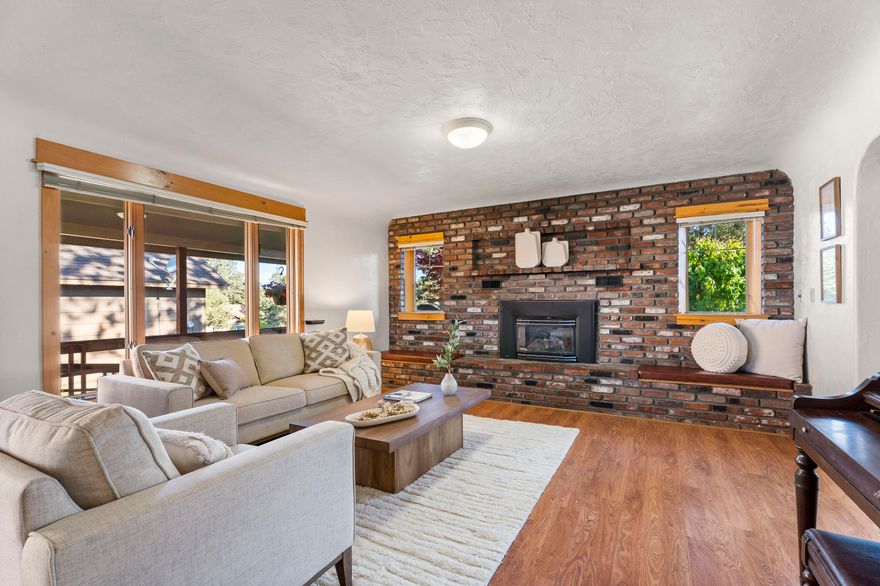 Discover charm, character & opportunity on this spacious .25-acre RM zoned lot located in the heart of Old Mill Estates. Just a few blocks from the Deschutes River, Old Mill District & Amphitheatre, this property places you at the center of Bend's most vibrant lifestyle amenities. Float the river, enjoy a concert, or explore shopping & dining just steps away. This lovingly maintained single-level home blends original character w/ thoughtful updates. Highlights incl. oversized rooms, SS appl's, newer furnace & electrical panel, A/C, ADA features, room for RV parking, & offers multiple lovely outdoor living spaces. The 4th BD features a private entrance & a ½ bath, ideal for a home office. A rare bonus is the 320 SF full-height finished basement, offering endless possibilities. With zoning that allows for a min of 5 multi-family units, this is not just a beautiful home, it's a prime investment opportunity in one of Bend's most sought-after location. The broker is related to the seller.