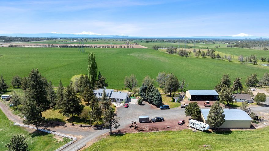 The real deal in Powell Butte- welcome to Lazy JW Ranch. This impressive 323-acre ranch features over 260 acres of irrigated pasture and hay ground- 196 acres of C.O.I.D. water rights and 65 acres of well water all of which is fully fenced and cross-fenced for higher efficiency and better utilization and larger crop and grazing yields. The irrigation system has also been enhanced for easier operation and less man hours. This working ranch is turnkey, complete with a shop, hay barn, equipment storage, corrals, a bunkhouse (ready for a remodel), and a spacious 3-bed, 3-bath two-story main home with office and garage. The sellers will consider seller financing on approved credit. Lazy JW Ranch is truly one of the best values in Powell Butte. Call now regarding the outstanding value!