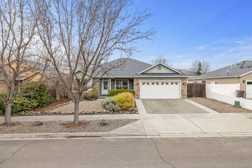 Welcome to 3208 Balsum Way, a stunning 3 bdrm/2 bath residence in the heart of East Medford, This 1852 sq.ft. home on a .15 acre lot boasts modern amenities including a new heating and air system, stainless steel appliances, and a gas fireplace. Enjoy the luxurious touch with heated floors in both bathrooms, complemented by a jetted tub. The property features hardwood floors, vaulted ceilings, and granite counters, creating an elegant and inviting atmosphere. With fenced landscaping, this residence offers both privacy and charm. Conveniently located near hospitals and shopping centers, this home seamlessly blends comfort and accessibility. Call today before this gem is gon.