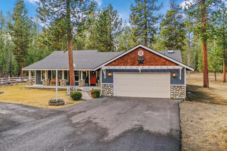 First time on the market for this meticulously maintained single story home. Farmhouse details throughout this home will charm anyone that enters. Spacious Living Room with beautifully stoned fireplace to cozy up by on cold nights. Newer quartz countertops in the Kitchen as well as the bathrooms. Master Bedroom has french doors that open to the large paver patio in the backyard as well as a Master Bathroom with a jetted soaking tub. Skylights bring natural light into both baths. There is wonderful seperation between the Master Bedroom and 2 other bedrooms + den/office. Custom cabinets and shelving in laundry. This 1.48 acre lot has only the best Ponderosa trees left to grow and mature. Circular asphalt driveway. New roof and exterior paint in the last 2 years. Plenty of room to build your dream shop on the side or rear of property.