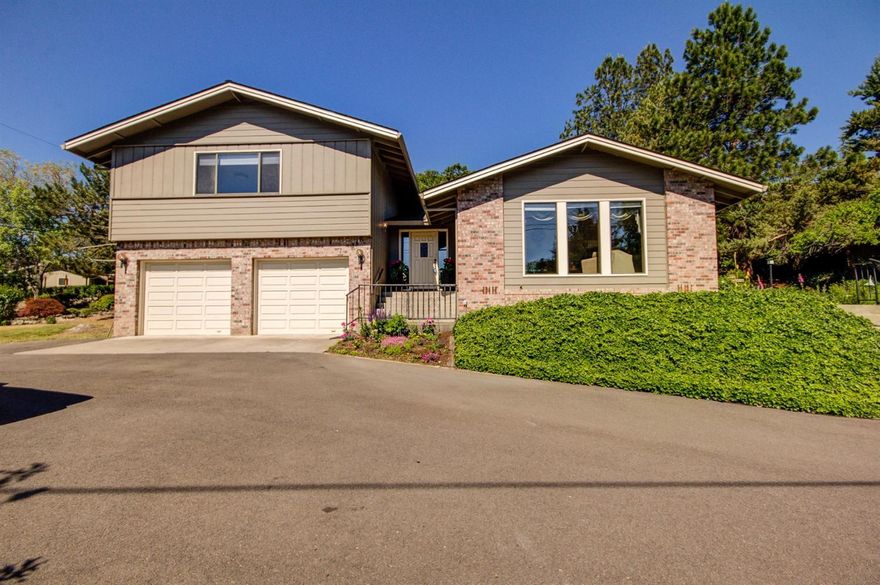 Contemporary light filled home on a very desirable half acre East Medford lot in the Belair Heights Subdivision. A bit of country in the city. Close to Rogue Valley Country Club, hospital and all life's necessities. This one owner home offers you 3 bedrooms and two updated bathrooms. The large master suite with walk in closet and views to the east complete the upper floor. The main level offers large view windows and new gas fireplace make the living room a cozy place. Well lit kitchen with loads of custom solid core cabinets for storage and Jen Air downdraft cook top and grill. The extra large walk in pantry has enough space to store all your extra kitchen and entertaining items plus room for a second refrigerator or freezer. Beautiful bay windows in dining room look out to the formal patios, and a nook with views of the backyard. The lower level has a large family room with wet bar that is perfect for family game night and access to the two car garage. Enjoy your morning coffee up on