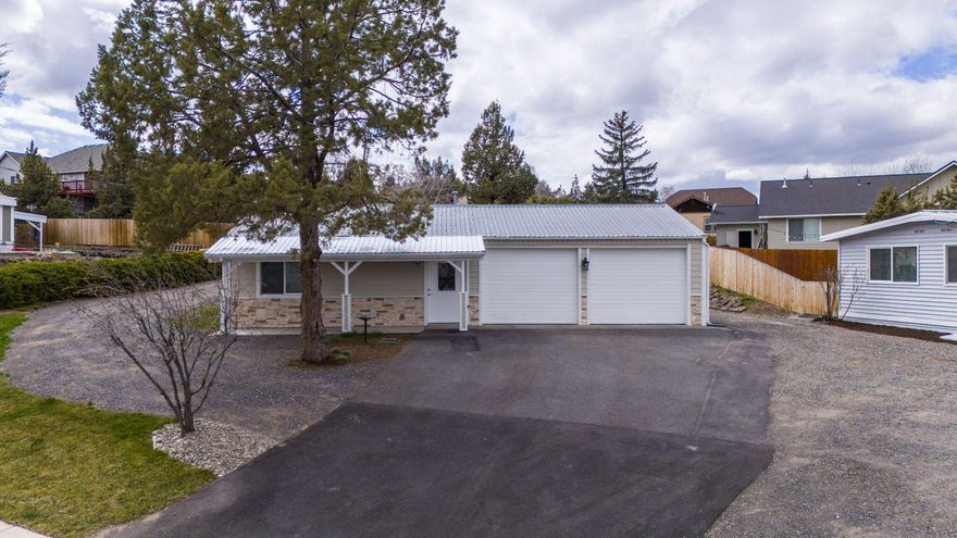 What a great find in SW Redmond.  Adorable 1 bedroom home with attached double car garage.  Large lot so room to build a home or place a mfg home on the lot.  (Any development due diligence will be the responsibility of the buyer..    Quiet location with easy access to Hwy 97.  (Also see MLS# 220179304                                                              These homes are side by side and would make a great buy for an investor or multi family living. )