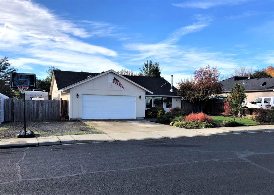 Beautifully updated 3/2 home on a good sized lot, this one has it all!  Recent interior updates include, laminate floors, granite counters with tile back splash, paint which includes all cabinets, stainless appliances, interior doors, light fixtures, tankless water heater, and a wood stove. Large primary suite with updated bathroom and a walk-in closet. Two guest bedrooms and an updated guest bath. Open floor plan with formal living and dining area. Breakfast nook and family room. Large kitchen overlooking the family room, perfect for entertaining. Sliding glass door leading out to a new covered deck with open beam roof. Large backyard with a hot tub and above ground pool. Large storage shed and over 50 feet of RV parking with power hookups. Numerous fruit trees, berry bushes, and herb plants. New gutters and attic solar fan. Super clean and tastefully updated with current colors and styles. This is a must tour!