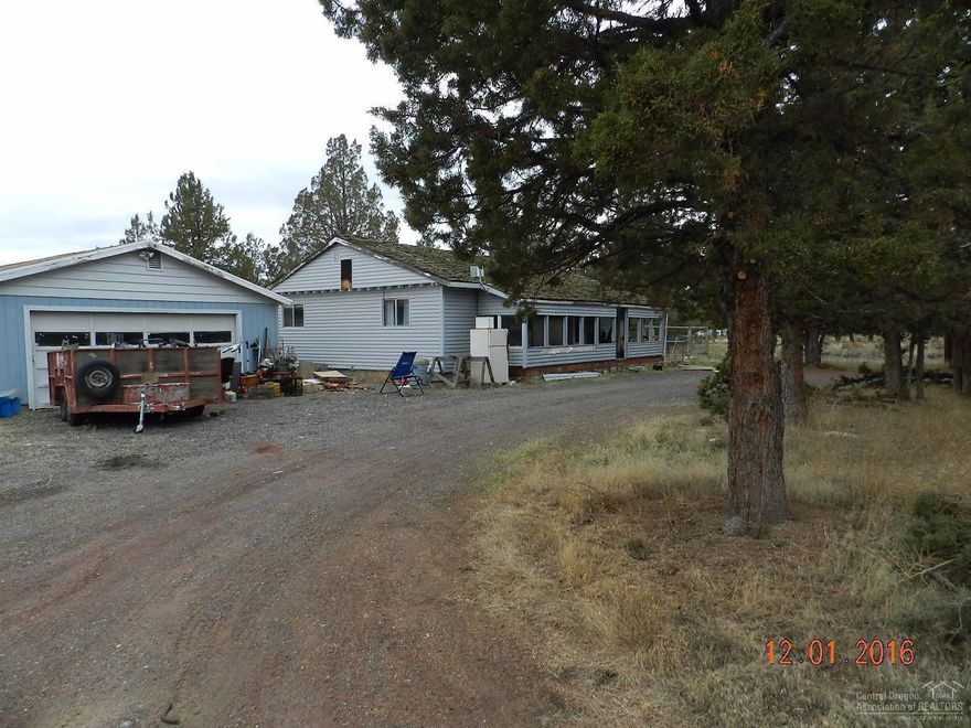 A true handyman special! Don't miss this opportunity to own an affordable small acreage parcel with a stick built home. There are plenty of out buildings for grown-up toys and projects as well as 4-H and hobby animals. including an over-sized detached 2 car+ garage with office or hobby room.