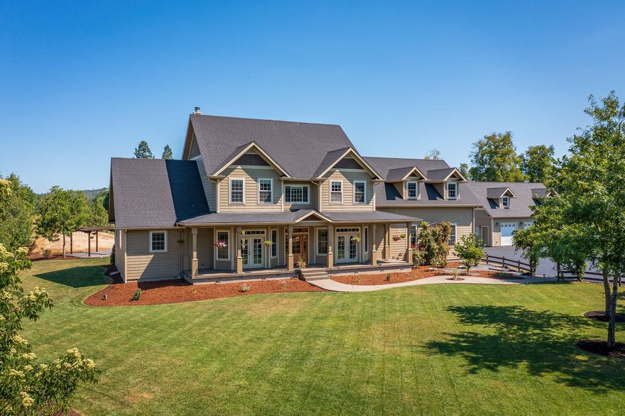 Beautiful custom home that offers privacy close to town. Boasting almost 4,000 square feet with 2 ensuite guest bedrooms, primary bed/bath, and a heated pool, this is a perfect family home! The Primary Suite is on the main level with back porch access, a soaking tub, dual walk in travertine shower, double vanity with granite counters, and his/hers walk-in closets. Both the Primary Bedroom and Kitchen have heated tile flooring. The Kitchen includes custom cabinets with soft close features and granite counter tops, with gas range, convection oven/second electric wall oven. The open floor plan with large dining area and living room is perfect for entertaining. Upstairs are the guest bedrooms and large bonus room with wet bar/mini fridge that could be set up for in home theatre or entertainment area. 5 parking spaces in total, with a insulated detached shop with storage space on the second level and a 1/2 bath with exterior RV Hookups. Too many amenities to list! Schedule your showing!