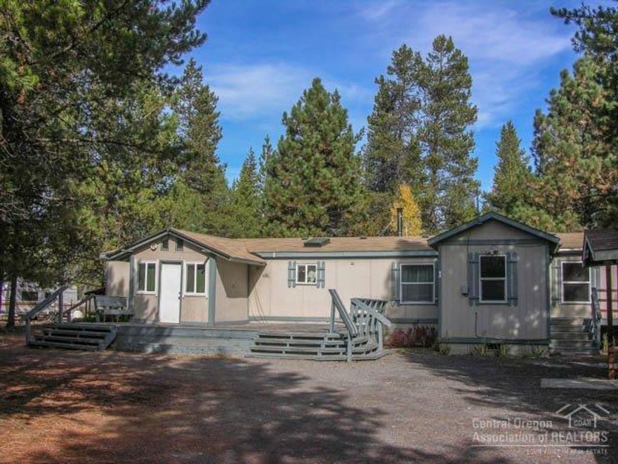 Large 2000+ sqft. Home on a Big Acre! Friendly Priced 1990 built 4Bd + Office & 2Ba home features: vaulted great room with wood stove open dining/kitchen with skylight, pantry, r/o, d/w & ref, laundry & storage mud room, master suite with big walk-in & 2nd closet & private bath w/skylight, dbl vanity, and big shower stall, 3 additional bedrooms on opposite side of home + office, FA heating & Central AC, huge front & back decks (partially covered) + covered breezeway to front door & newer roof too!