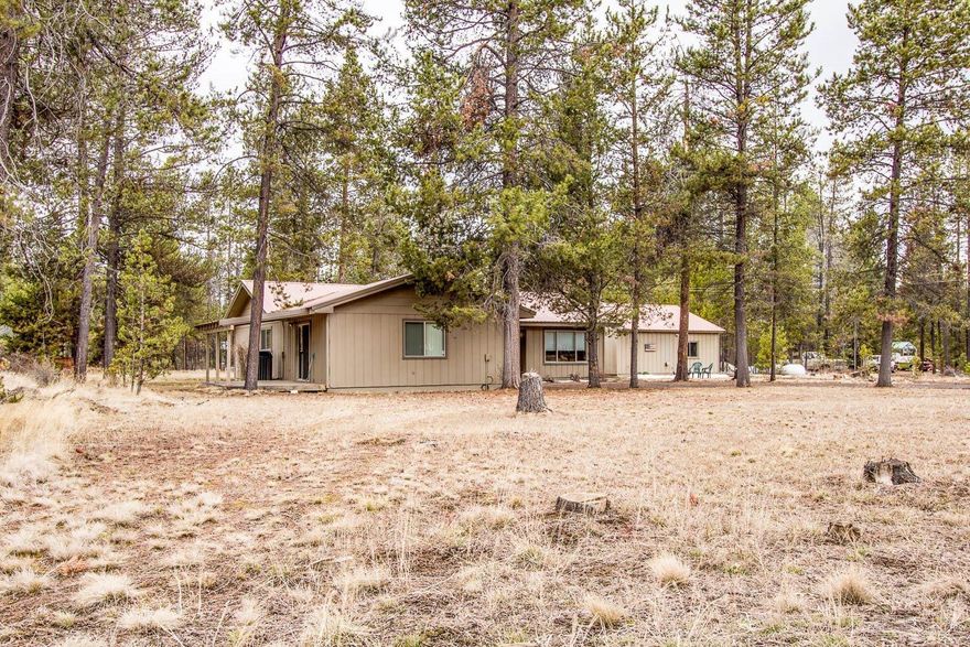 WOW... Close to amenities but still on an acre. Easy access to HWY 97, almost 2000sqft of living space. Clean, solid house with metal roof. De-attached double garage, and possible fourth bedroom. Large out door deck and big yard. Call to schedule a showing today!